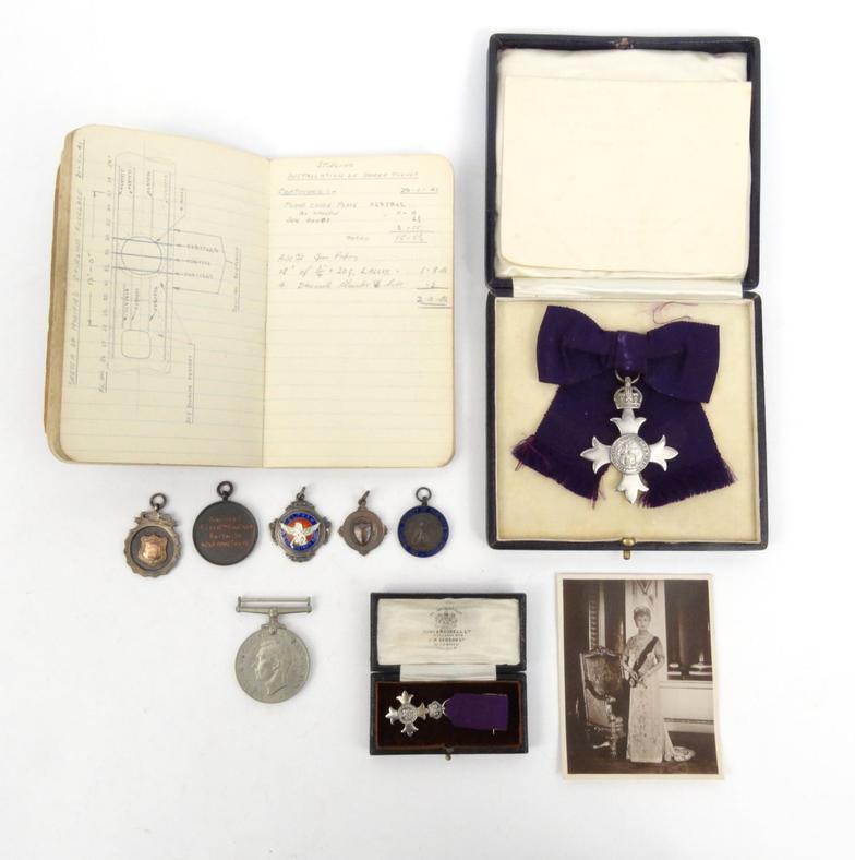 Military interest boxed silver MBE including a dress version, together with paperwork, 1940s