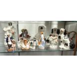 Collection of Victorian and later Staffordshire figures, spaniels, etc, and a wash jug, the