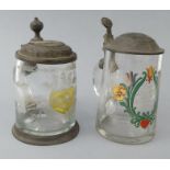 Two Victorian German glass tankards with pewter lids - one hand enamelled with flowers, one etched