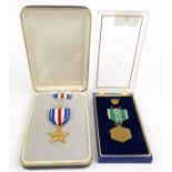Two military interest boxed United States of America medals : For Condition reports please visit