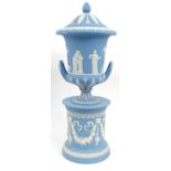 Large Wedgwood blue and white Jasperware vase and cover on stand, decorated with classical scenes,