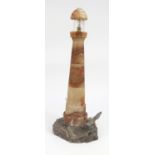 Carved alabaster and slate lighthouse table lamp with hand painted lead seagull to the base, 50cm