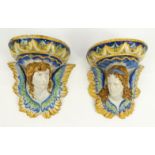 Pair of Continental Italian Cantagalli Maiolica pottery wall brackets hand painted with winged