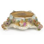 Hand painted floral encrusted stand decorated with ladies, marks to base including impressed