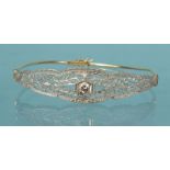 14K gold bracelet set with a solitaire diamond, 5.5cm diameter, approximate weight 6.0g : For