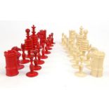 Carved bone red stained chess set, the largest 9cm high : For Condition Reports please visit www.