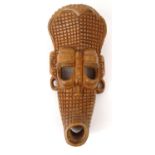 Carved wooden tribal mask with chequered pattern, inscribed 'SAIRE' to back, 35cm long : For