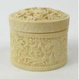 Oriental Chinese carved ivory box and cover decorated with a dragon chasing a pearl, with mirrored