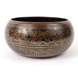 Oriental Chinese Tibetan bronze fortune teller's bowl, the centre decorated with Buddha, 15cm