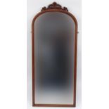 Victorian dome topped mahogany framed mirror with ornate scrolling crest, 137cm high x 56cm wide :