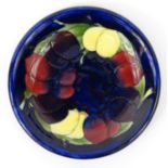 Moorcroft Plum Wisteria patterned pottery plate, impressed mark to base, 22cm diameter : For