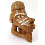 Carved hardwood Solomon Islands canoe figure head with inlaid mother of pearl, 20cm high pearl, 24cm