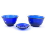 Three oriental Peking style blue glass bowls, the largest 11.5cm : For Condition Reports please