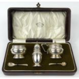 Cased silver three piece cruet with blue glass liners, AEP & Co Birmingham 1934-35, with matching