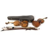 Two old wooden violins - one with wax seal to neck, together with seven assorted bows : For