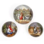 Three Victorian glass picture paperweights comprising Lady Godiva, Little Red Riding Hood and a
