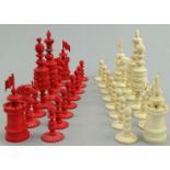 Large carved ivory red stained chess set, the largest piece 13cm high : For Condition Reports please