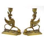Pair of Victorian brass griffin candlesticks, 19cm high : For Condition Reports please visit www.