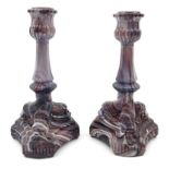 Pair of Victorian Sowerby pressed mauve glass agate patterned candlesticks with dolphin supports,