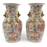 Large pair of oriental Chinese vases decorated with panels of court scenes and gilt dragon