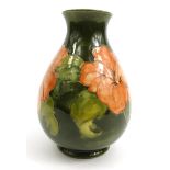 Moorcroft Hibiscus patterned pottery vase, Potters to the Late Queen Mary label to base, 22cm high :