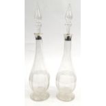 Pair of cut glass olive oil bottles with silver collars, J. G&S Birmingham 1900-01, 33cm high :