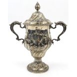 Large Georgian silver two handled trophy and cover with embossed floral decoration, London 1759-