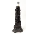 African ebonised table lamp carved with sea creatures, 39cm high excluding the fitting : For