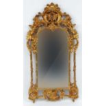 Ornate gilt framed mirror with acanthus, sea scroll and shell shaped decoration, 144cm high x 76cm