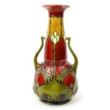 Mintons aesthetic twin handled majolica pottery vase decorated with a flower, No 8, 25cm high :