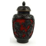 Oriental Chinese lacquered tea canister carved with floral decoration, the lid and base with