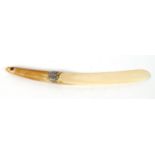 Ivory page turner mounted with a white metal mythical bird, 31cm long : For Condition Reports please