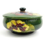 Moorcroft Hibiscus patterned pottery powder bowl and cover, impressed mark to base, 14.5cm