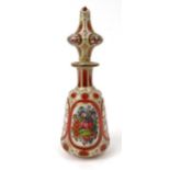 Victorian red and white overlaid glass scent bottle hand painted with panels of flowers, 21cm high :