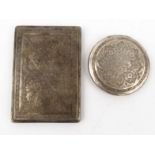 Middle Eastern silver coloured metal compact and cigarette case, both with ornate chased decoration,