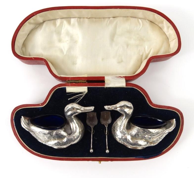 Pair of novelty silver duck salts with blue glass liners, HW Ltd Birmingham 1905-06 and numbered