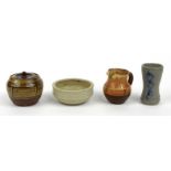 Four Winchcombe Studio Pottery items including a salt glazed vase, finger trail decorated sugar bowl