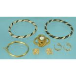 Assorted jewellery including a pair of dragon earrings, Cartier design earrings, gilt metal cameo
