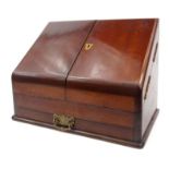Victorian mahogany writing cabinet fitted with two hinged doors and slatted interior, with