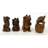 Four oriental wooden carvings including a bird on a barrel, dragon and two lucky cats with beaded