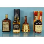 Four bottles of alcohol comprising Glen Moray whisky, Hennessey cognac, Cointreau liqueur and