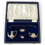 Cased silver dolls' house tea service with tray, AM & Co Birmingham 1969-70, the tray 15cm long :