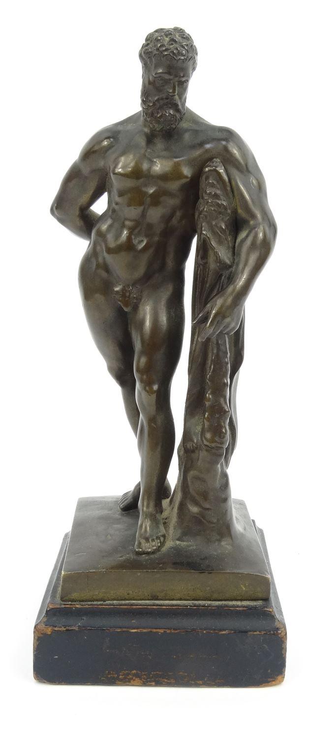 19th Century bronze figure of Hercules, impressed F. Hesse Cassel and Geschutzt, mounted on a wooden