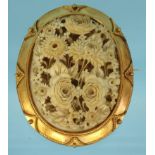 Well detailed carved ivory floral brooch set in a gold coloured metal mount, 6cm long : For