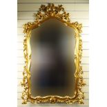 Ornate gilt framed wall hanging mirror, 132cm high : For Condition Reports please visit www.