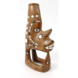 Carved hardwood Solomon Islands canoe figure head with inlaid mother of pearl, 20cm high pearl, 24cm