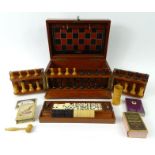 Victorian mahogany games compendium box with wooden chess set stamped with a crown, bone dominoes,