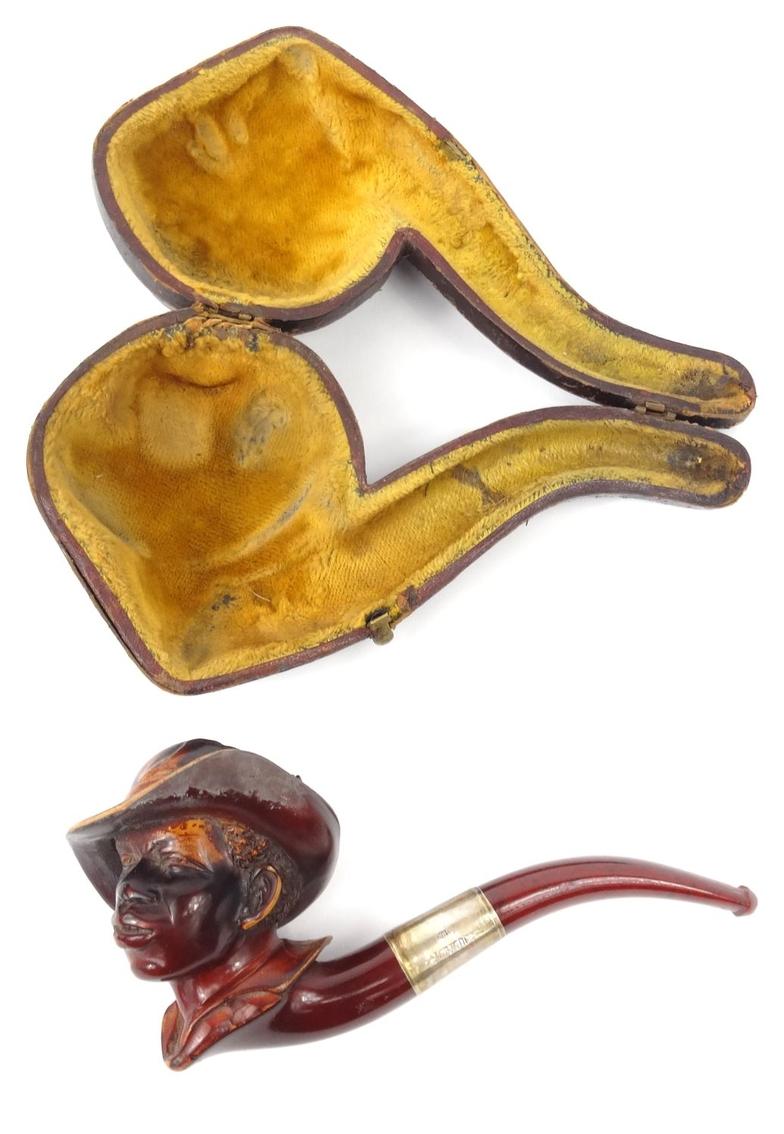 Cased meerschaum pipe of an African male with silver collar, 15cm long : For Condition Reports