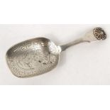 Georgian silver caddy spoon with scallop terminal and floral decoration to the bowl, hallmarked