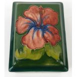 Moorcroft Hibiscus patterned pottery box and cover, impressed mark and paper label to base, 12cm x